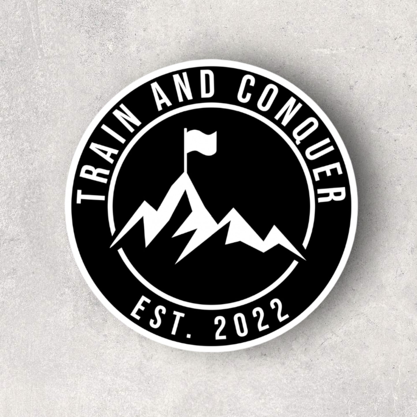 TRAIN AND CONQUER EST. STICKER - BLACK AND WHITE