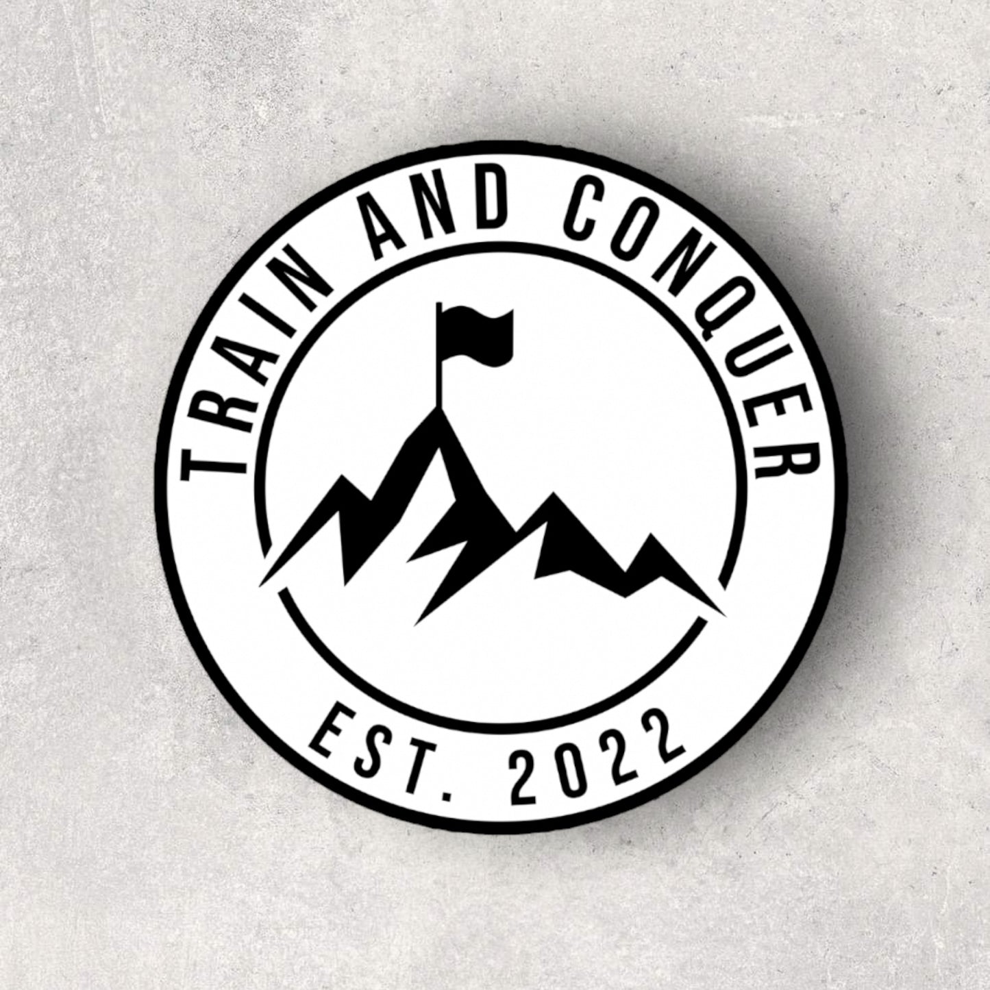 TRAIN AND CONQUER EST. STICKER - WHITE AND BLACK